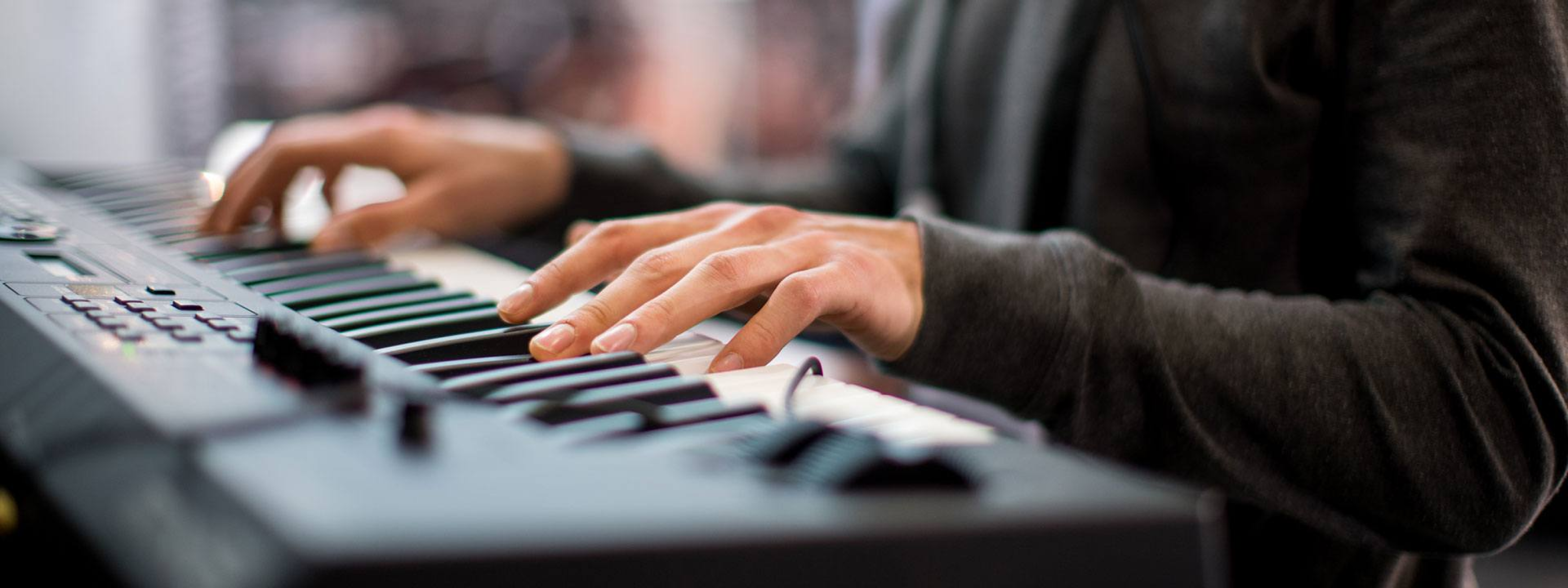 Musician playing an electronic keyboard
