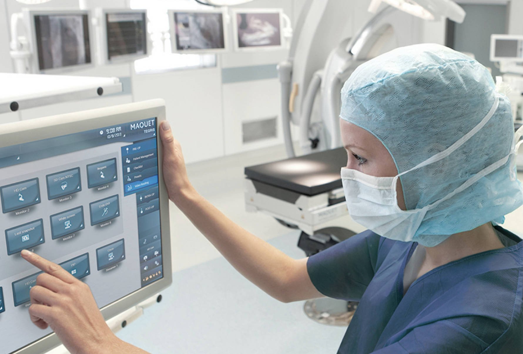 Medical professional using touchscreen interface in operating room