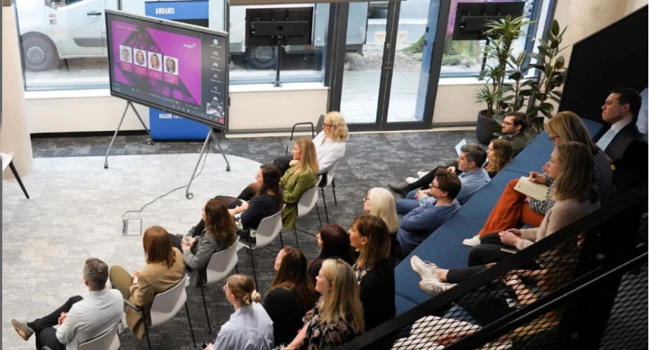 Team attending a presentation in a modern office environment