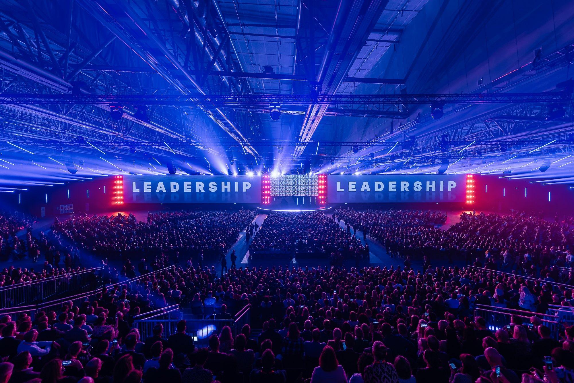 Large-scale corporate leadership conference with full audience